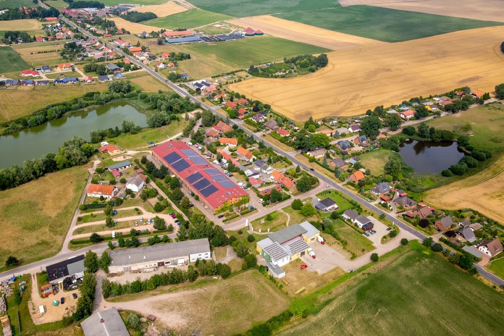 Aerial photograph Bollewick - Village view of Bollewick with the historical barn of Bollewick on its pond in the state of Mecklenburg - Western Pomerania. Germany's largest cobblestone barn is home to shops and workshops of arts and craft producers