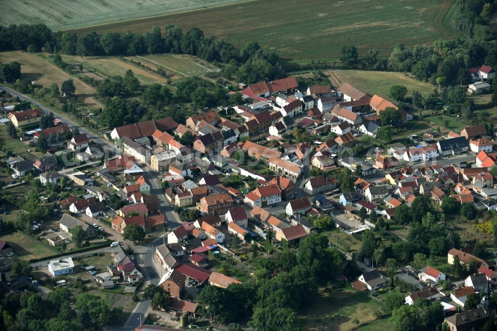 Grüningen from above - View of the village of Grueningen in the state of Thuringia. The village is surrounded by agricultural fields and consists of residential buildings and farms