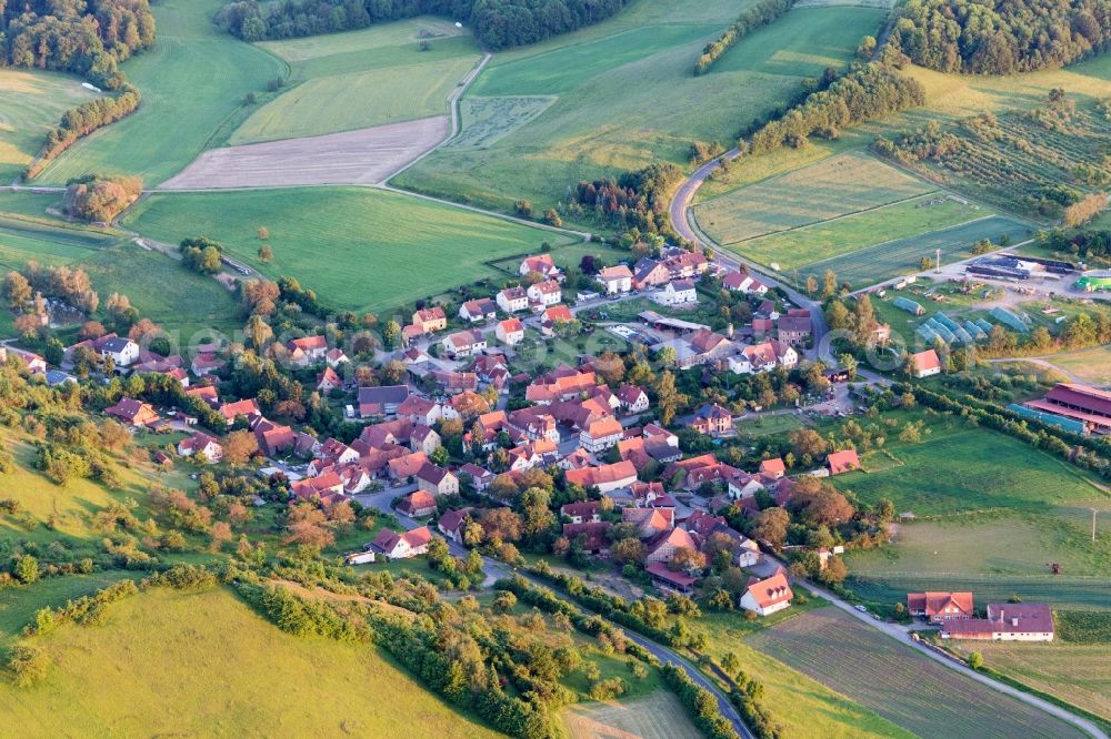 Eschenau from above - Village - view on the edge of agricultural fields and farmland in Eschenau in the state Bavaria, Germany