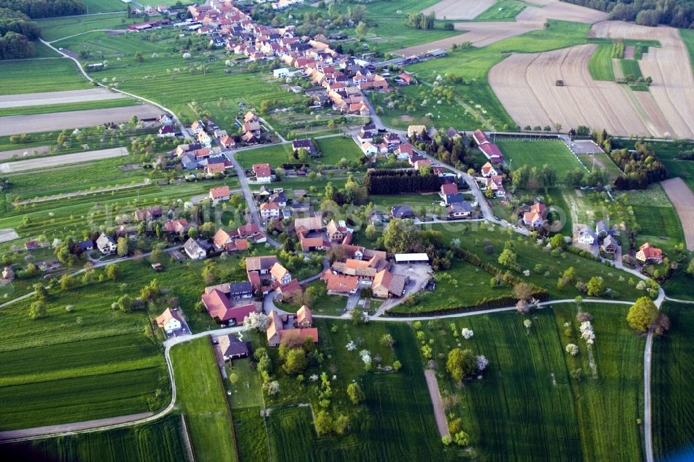 Aerial image Laubach - Village - view on the edge of agricultural fields and farmland in Laubach in Grand Est, France