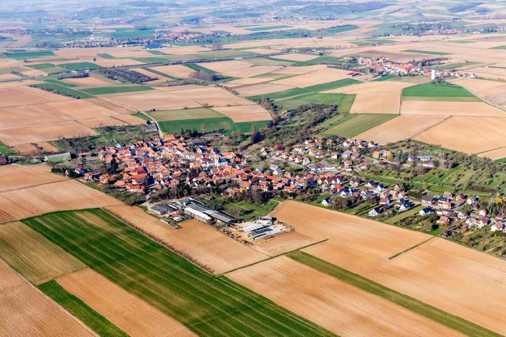 Aerial image Melsheim - Village - view on the edge of agricultural fields and farmland in Melsheim in Grand Est, France