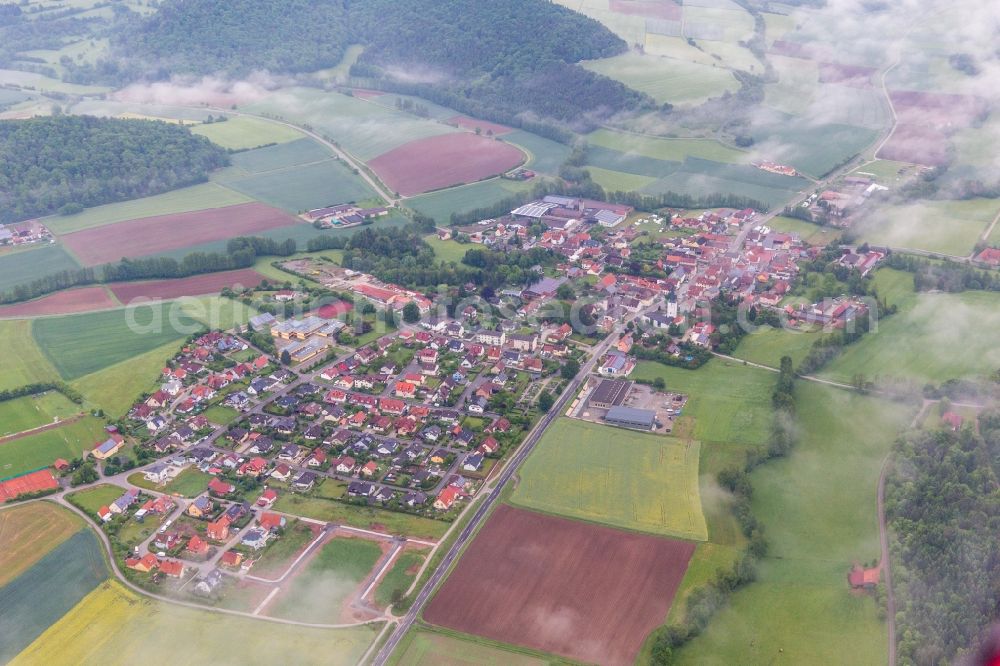 Rauhenebrach from the bird's eye view: Village - view on the edge of agricultural fields and farmland in the district Untersteinbach in Rauhenebrach in the state Bavaria, Germany