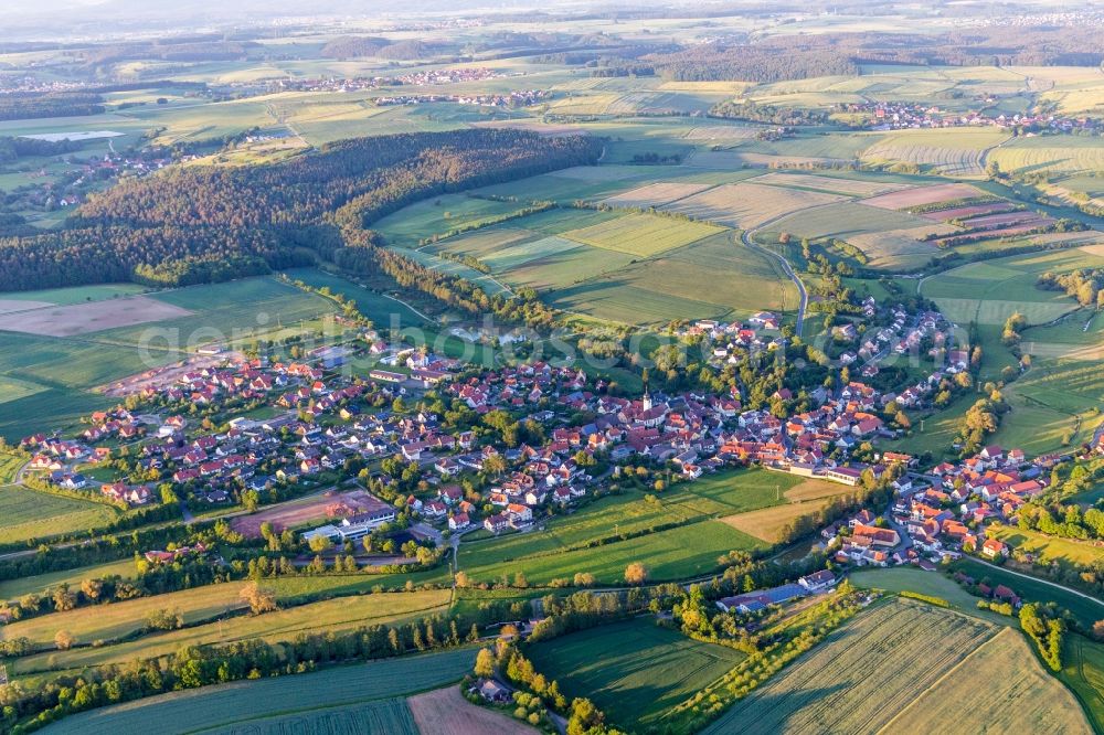 Aerial image Schönbrunn im Steigerwald - Village - view on the edge of agricultural fields and farmland in Schoenbrunn im Steigerwald in the state Bavaria, Germany