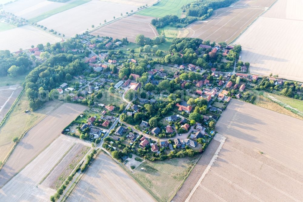 Aerial image Natendorf - Agricultural land and field borders surround the settlement area of the village in Natendorf in the state Lower Saxony, Germany