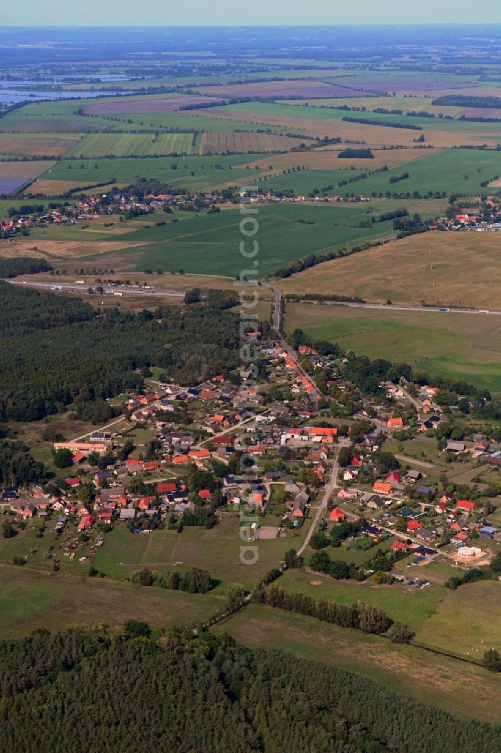 Blievenstorf from the bird's eye view: Village - view on the edge of forested areas in Blievenstorf in the state Mecklenburg - Western Pomerania, Germany