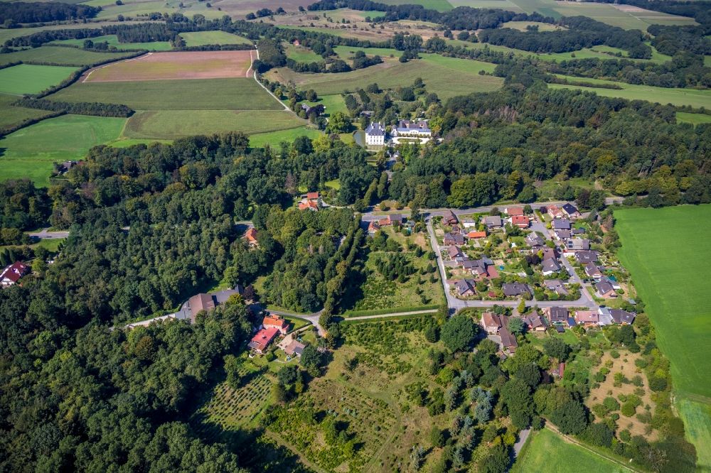 Hünxe from above - Village - view on the edge of forested areas overlooking the Castle Gartrop at the Schlossallee in Huenxe in the state North Rhine-Westphalia, Germany