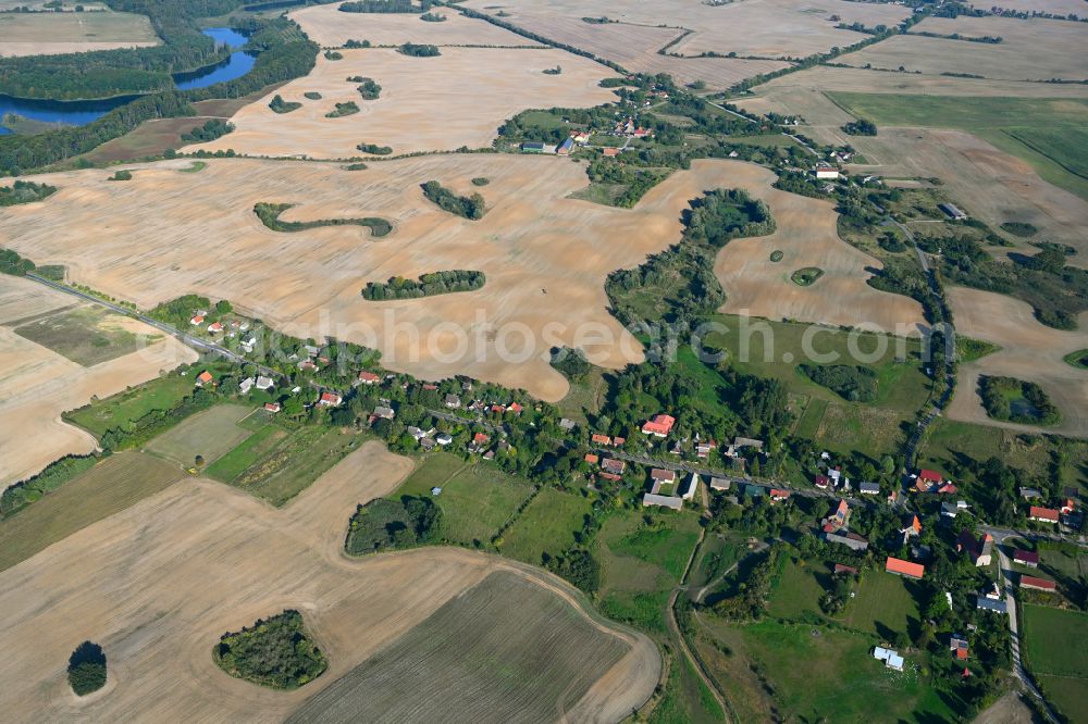 Klaushagen from the bird's eye view: Village - view on the edge of forested areas in Klaushagen in the state Brandenburg, Germany