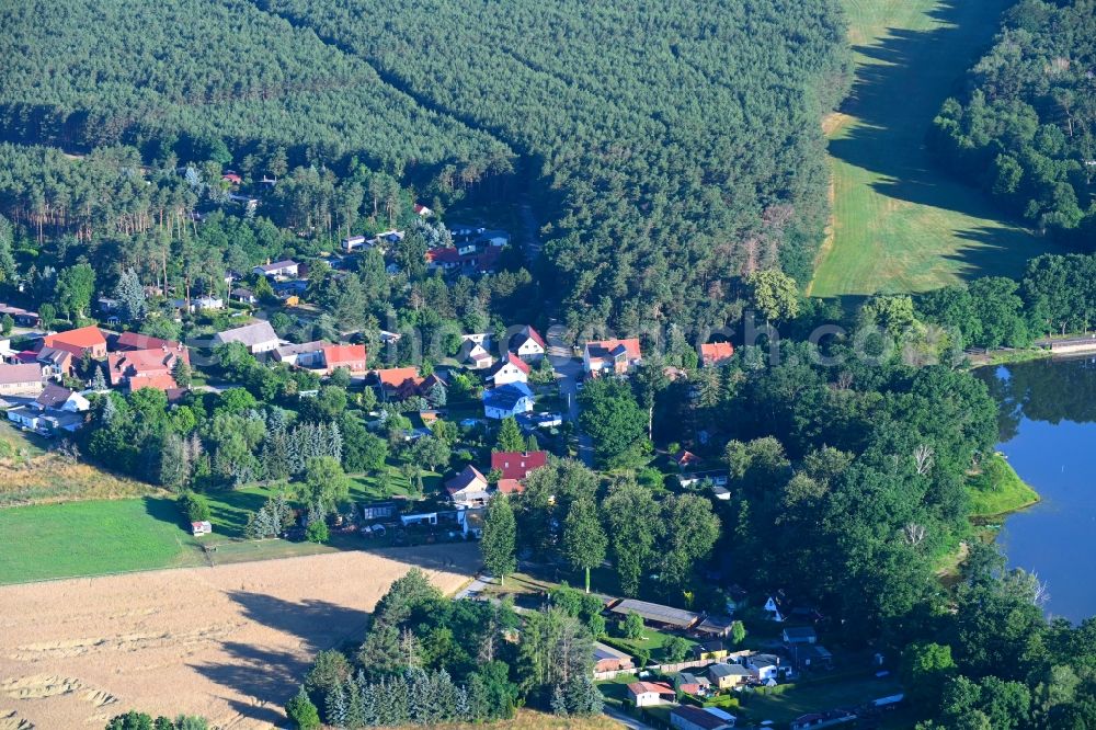 Körba from the bird's eye view: Village - view on the edge of forested areas in Koerba in the state Brandenburg, Germany