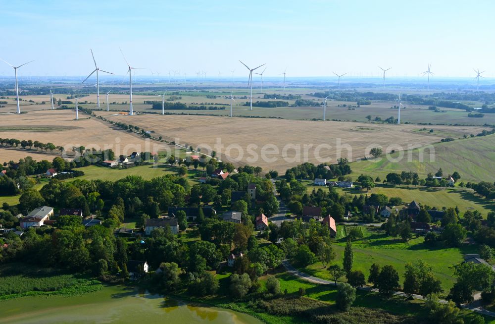 Milow from the bird's eye view: Village - view on the edge of forested areas in Milow in the state Brandenburg, Germany