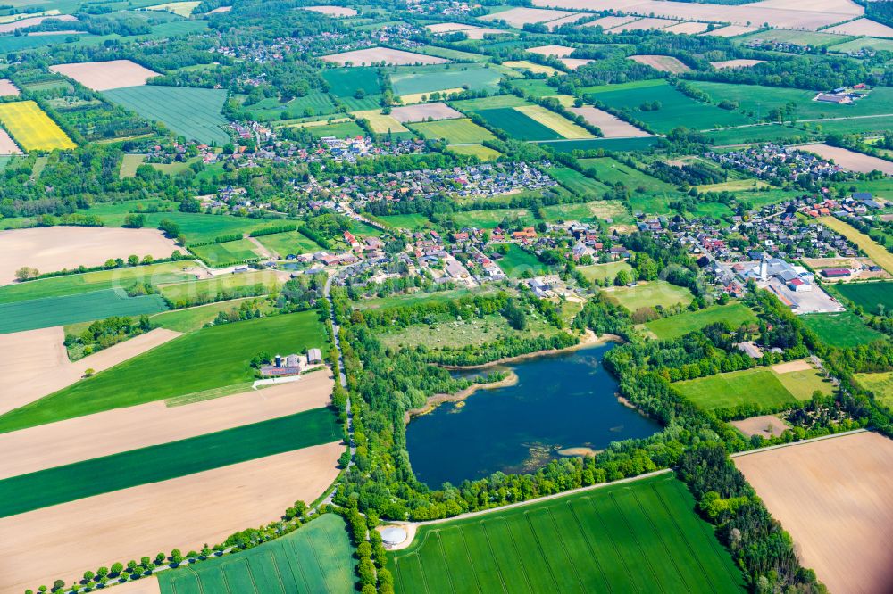 Aerial image Müssen - Village - view on the edge of forested areas in Muessen in the state Schleswig-Holstein, Germany