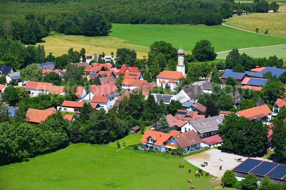Pfaffenhofen from the bird's eye view: Village - view on the edge of forested areas in Pfaffenhofen in the state Bavaria, Germany