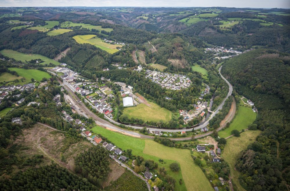Rummenohl from the bird's eye view: Village - view on the edge of forested areas in Rummenohl in the state North Rhine-Westphalia, Germany