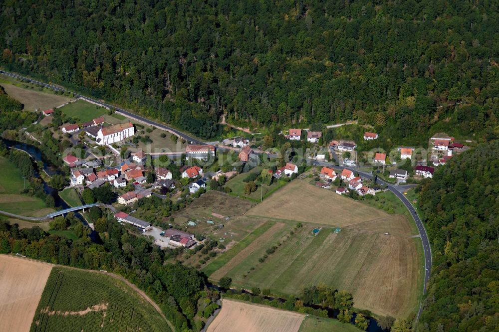 Schönau from the bird's eye view: Village - view on the edge of forested areas in Schönau in the state Bavaria, Germany