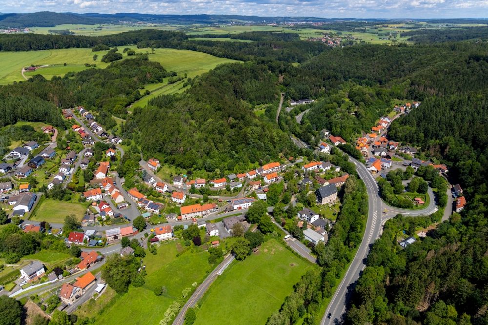 Thalitter from the bird's eye view: Village - view on the edge of forested areas in Thalitter in the state Hesse, Germany