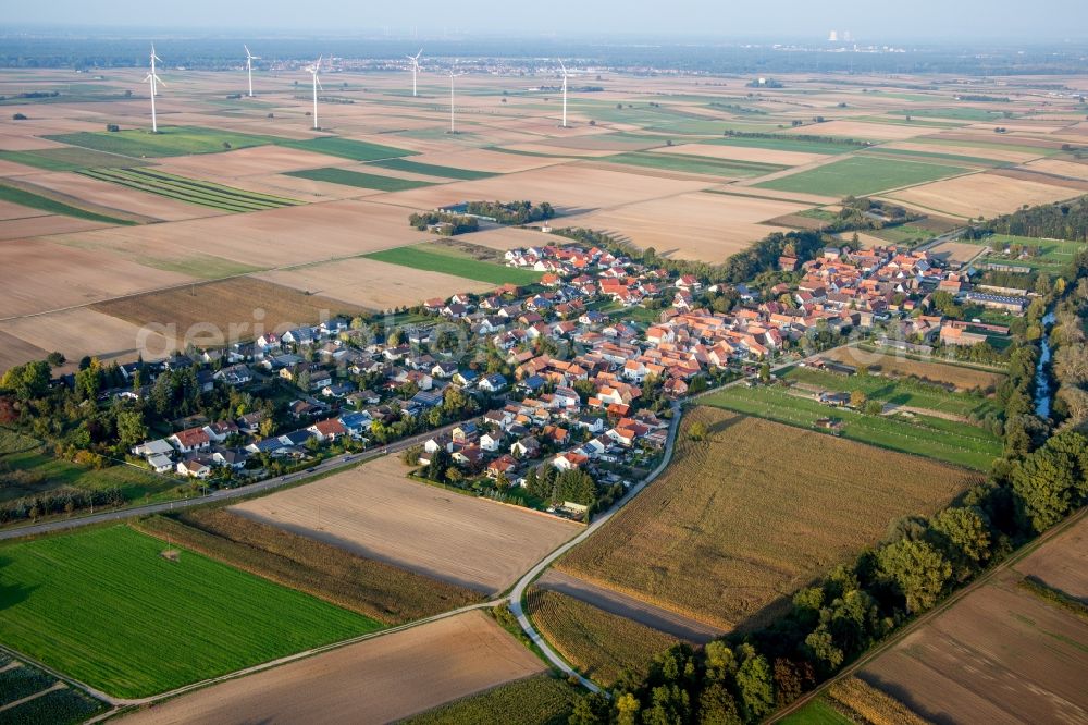 Herxheimweyher from the bird's eye view: Village - view on the edge of Windmills and agricultural fields and farmland in Herxheimweyher in the state Rhineland-Palatinate, Germany