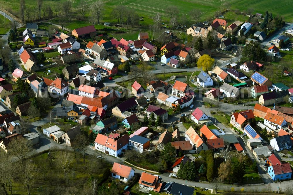 Hammerstedt from the bird's eye view: Agricultural land and field boundaries border the settlement area of a??a??the village Hammerstedt in the state Thuringia, Germany