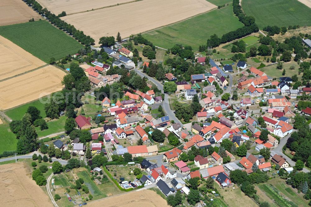 Hammerstedt from above - Agricultural land and field boundaries border the settlement area of a??a??the village Hammerstedt in the state Thuringia, Germany