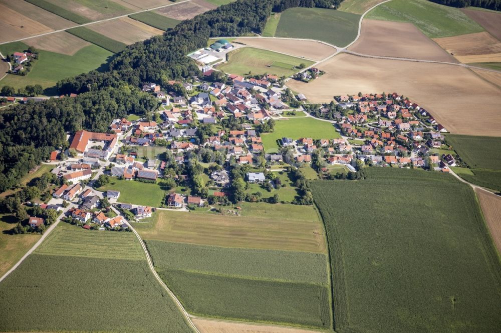 Aerial image Berghofen - Agricultural land, fields and forest surround the settlement area of a??a??the village in Berghofen in the state Bavaria, Germany