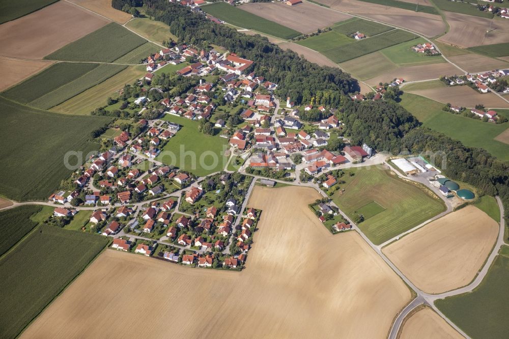 Aerial photograph Berghofen - Agricultural land, fields and forest surround the settlement area of a??a??the village in Berghofen in the state Bavaria, Germany