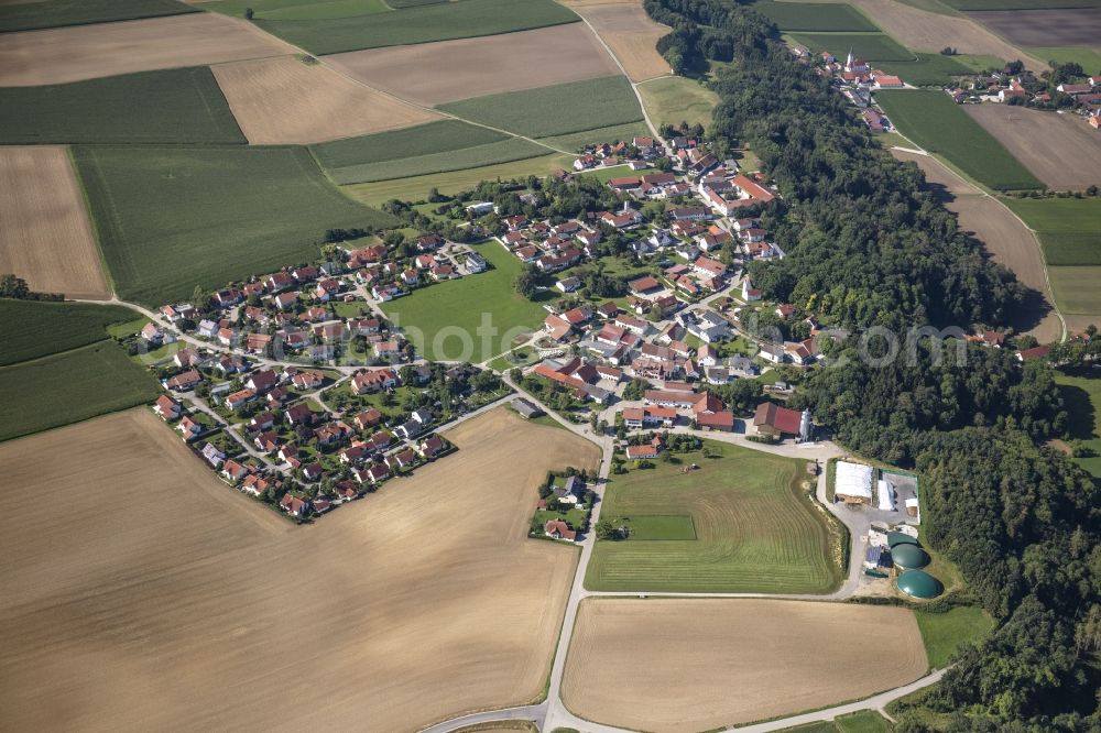 Berghofen from above - Agricultural land, fields and forest surround the settlement area of a??a??the village in Berghofen in the state Bavaria, Germany