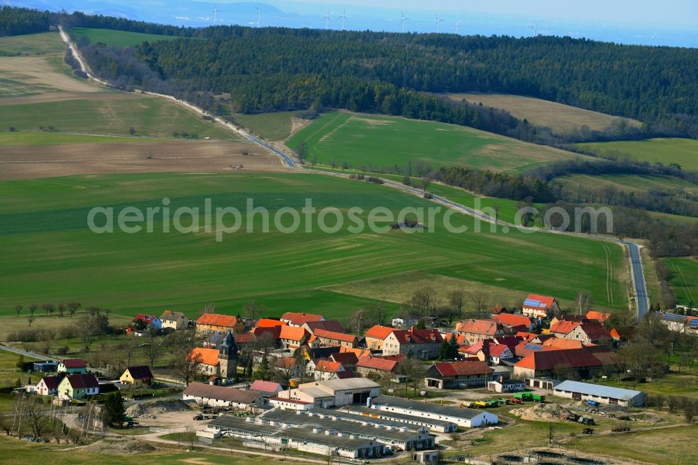 Nahwinden from above - Agricultural land and field borders surround the settlement area of the village in Nahwinden in the state Thuringia, Germany