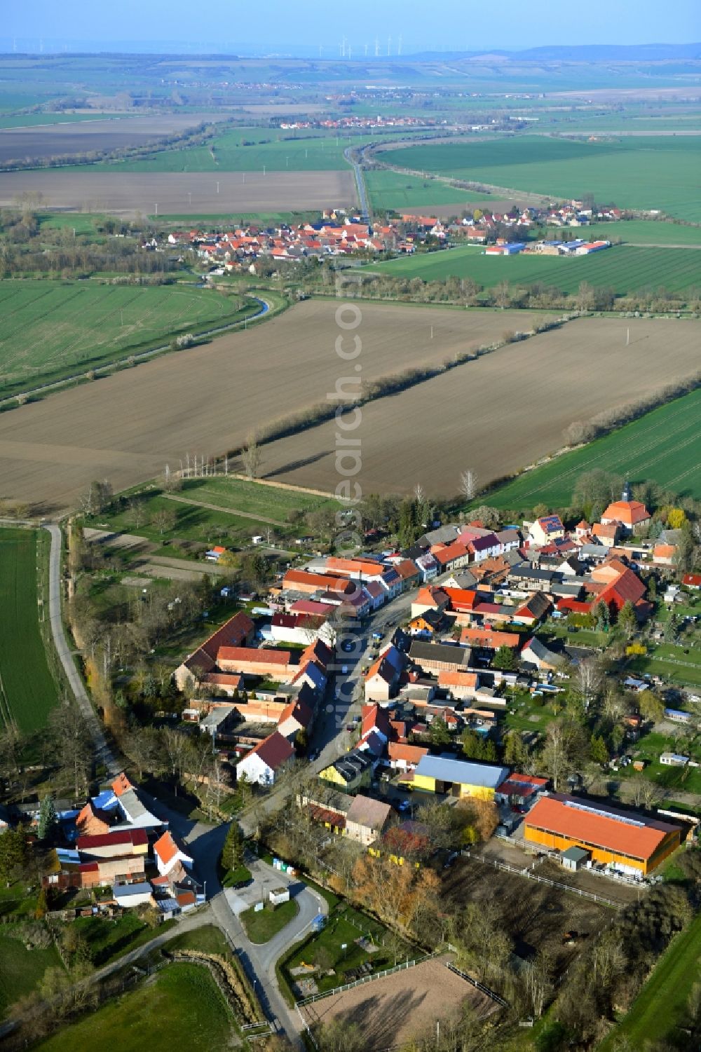 Waltersdorf from the bird's eye view: Agricultural land and field borders surround the settlement area of the village in Waltersdorf in the state Thuringia, Germany