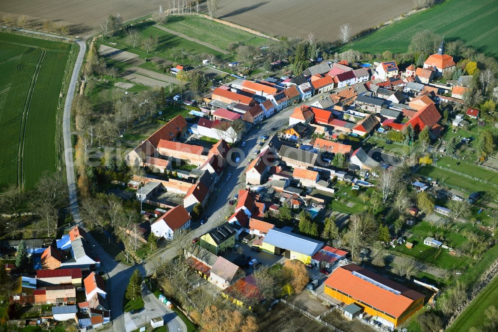Aerial image Waltersdorf - Agricultural land and field borders surround the settlement area of the village in Waltersdorf in the state Thuringia, Germany