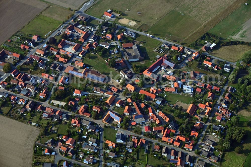 Almke from above - Agricultural land and field borders surround the settlement area of the village in Almke in the state Lower Saxony, Germany