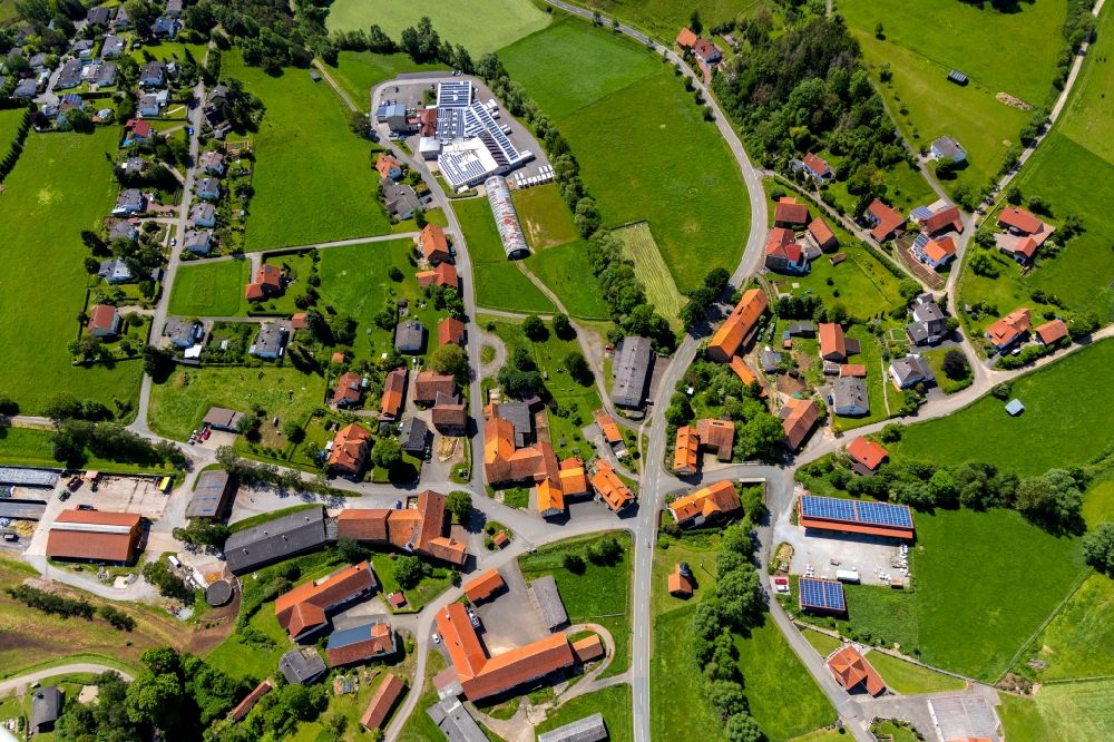 Aerial image Alraft - Agricultural land and field borders surround the settlement area of the village in Alraft in the state Hesse, Germany