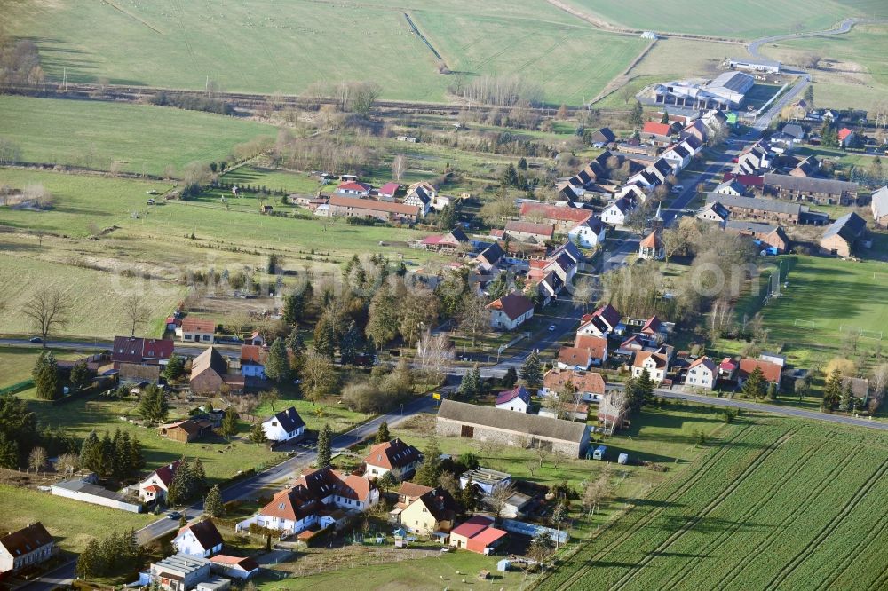 Aerial image Altlüdersdorf - Agricultural land and field borders surround the settlement area of the village in Altluedersdorf in the state Brandenburg, Germany