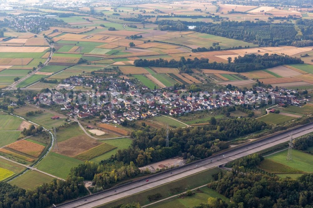 Aerial photograph Balzhofen - Agricultural land and field borders surround the settlement area of the village behind the motorway A5 in Balzhofen in the state Baden-Wuerttemberg, Germany