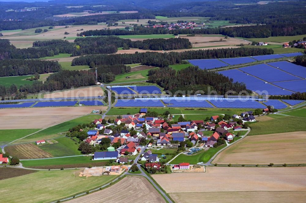 Aerial image Buckendorf - Agricultural land and field borders surround the settlement area of the village in Buckendorf in the state Bavaria, Germany