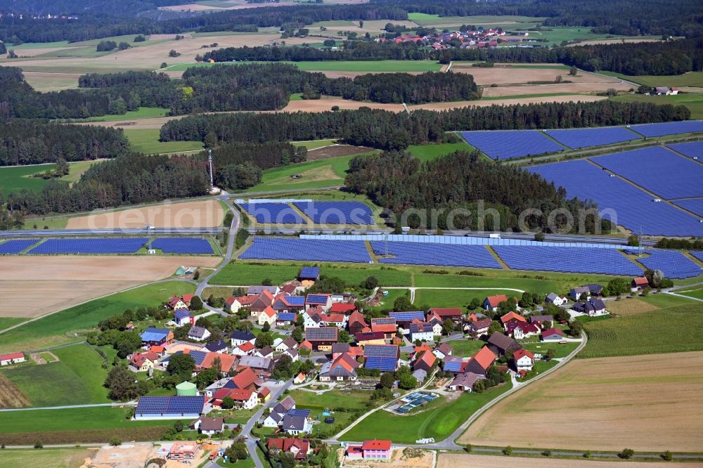 Aerial photograph Buckendorf - Agricultural land and field borders surround the settlement area of the village in Buckendorf in the state Bavaria, Germany