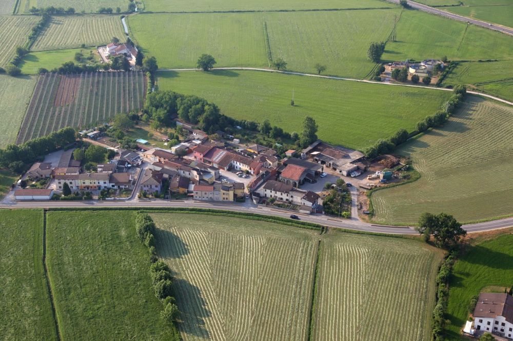 Aerial image Corte Gatti - Agricultural land and field borders surround the settlement area of the village in Corte Gatti in the Lombardy, Italy