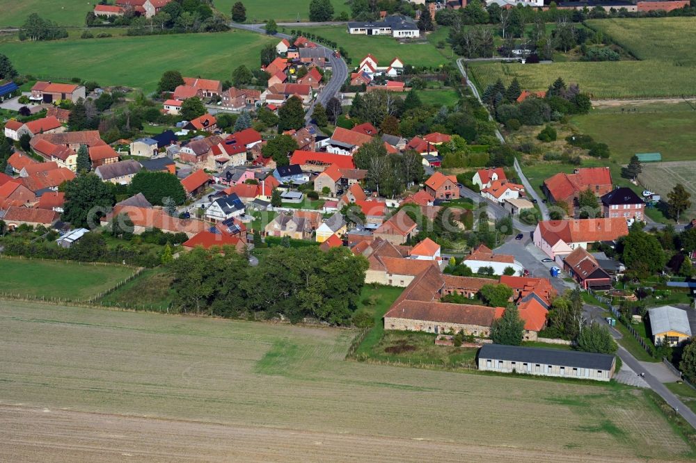 Döhren from above - Agricultural land and field borders surround the settlement area of the village in Doehren in the state Saxony-Anhalt, Germany
