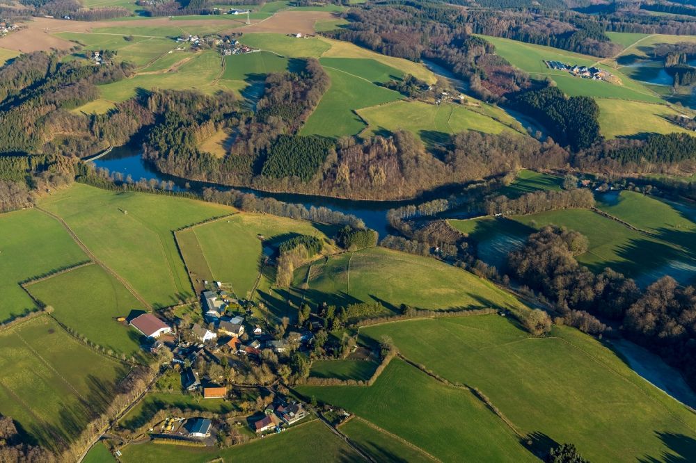 Ebinghausen from above - Agricultural land and field borders surround the settlement area of the village in Ebinghausen in the state North Rhine-Westphalia, Germany