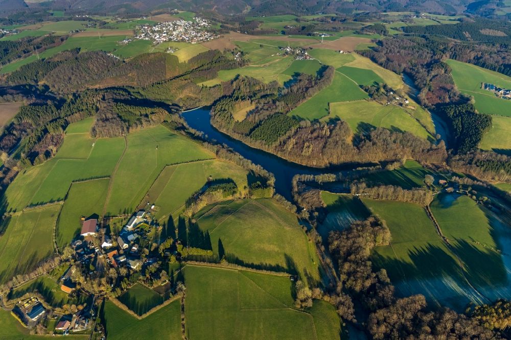Aerial image Ebinghausen - Agricultural land and field borders surround the settlement area of the village in Ebinghausen in the state North Rhine-Westphalia, Germany