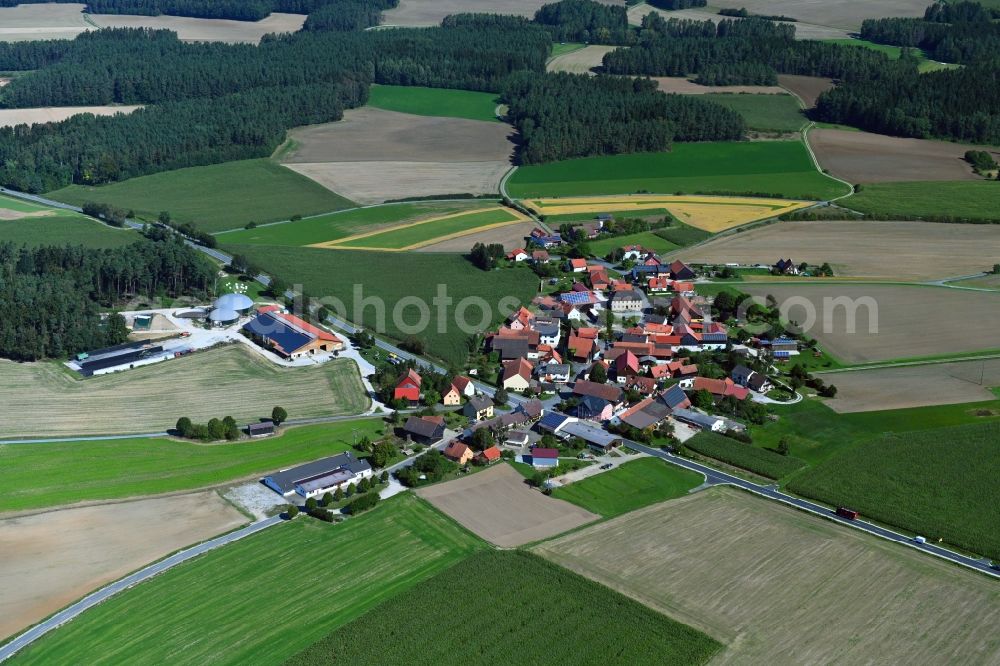 Eichenhüll from above - Agricultural land and field borders surround the settlement area of the village in Eichenhuell in the state Bavaria, Germany