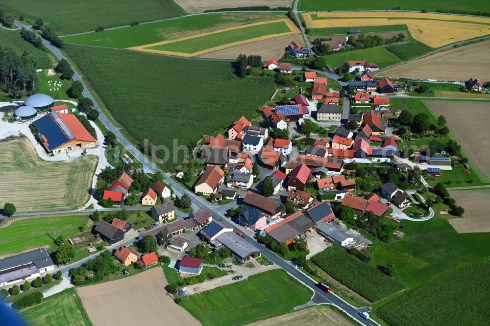 Aerial image Eichenhüll - Agricultural land and field borders surround the settlement area of the village in Eichenhuell in the state Bavaria, Germany