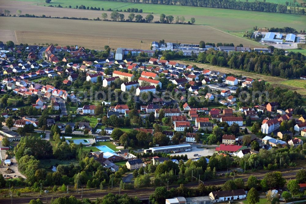 Aerial image Eilsleben - Agricultural land and field borders surround the settlement area of the village in Eilsleben in the state Saxony-Anhalt, Germany