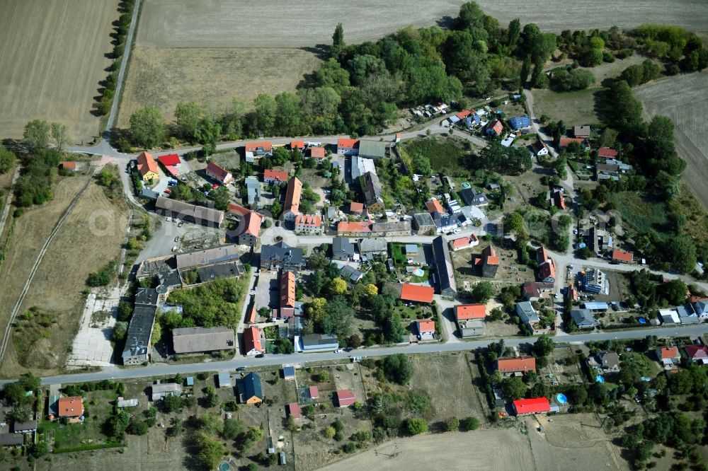 Eismannsdorf from above - Agricultural land and field borders surround the settlement area of the village in Eismannsdorf in the state Saxony-Anhalt, Germany