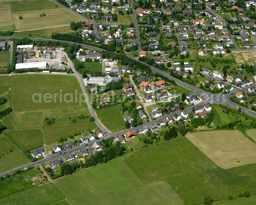 Aerial image Allendorf - Agricultural land and field boundaries surround the settlement area of the village in Allendorf in the state Hesse, Germany