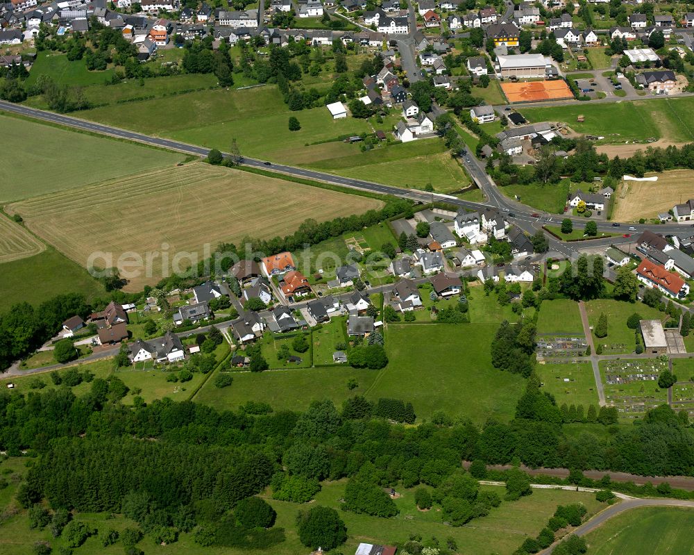 Aerial photograph Allendorf - Agricultural land and field boundaries surround the settlement area of the village in Allendorf in the state Hesse, Germany