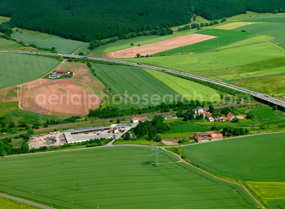 Alsenbrück-Langmeil from above - Agricultural land and field boundaries surround the settlement area of the village in Alsenbrück-Langmeil in the state Rhineland-Palatinate, Germany