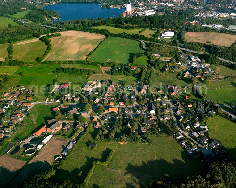 Alt Mölln from above - Agricultural land and field boundaries surround the settlement area of the village in Alt Mölln in the state Schleswig-Holstein, Germany