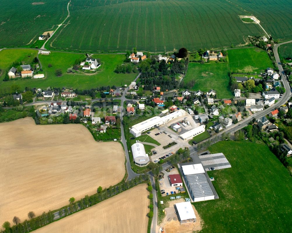 Altgeringswalde from above - Agricultural land and field boundaries surround the settlement area of the village in Altgeringswalde in the state Saxony, Germany