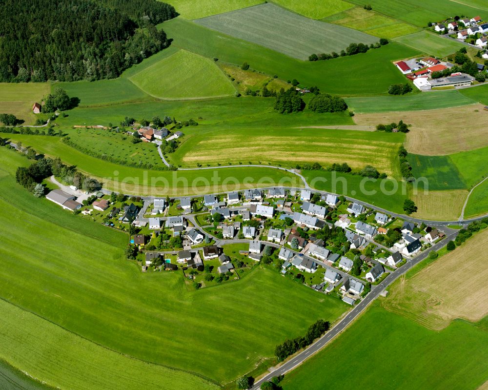Aerial image Altstammbach - Agricultural land and field boundaries surround the settlement area of the village in Altstammbach in the state Bavaria, Germany