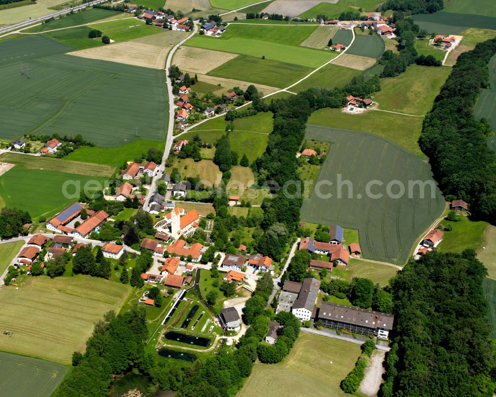 Alzgern from above - Agricultural land and field boundaries surround the settlement area of the village in Alzgern in the state Bavaria, Germany