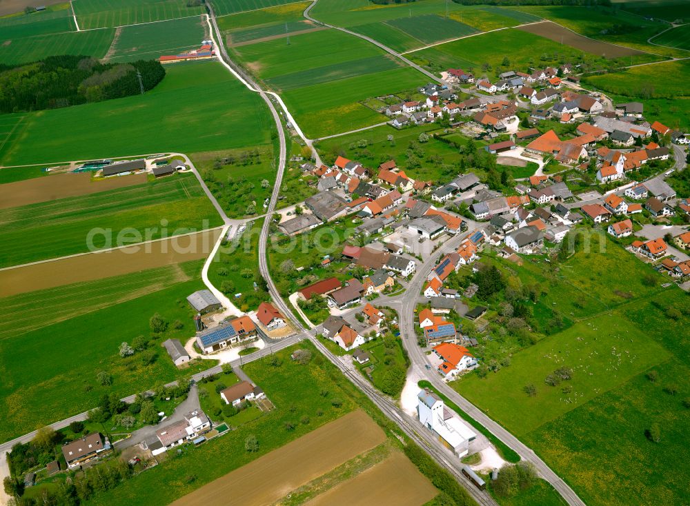 Aerial photograph Amstetten - Agricultural land and field boundaries surround the settlement area of the village in Amstetten in the state Baden-Wuerttemberg, Germany