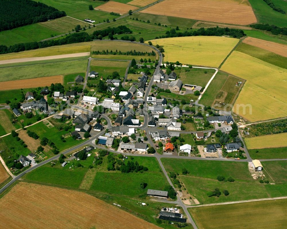 Asbach from above - Agricultural land and field boundaries surround the settlement area of the village in Asbach in the state Rhineland-Palatinate, Germany